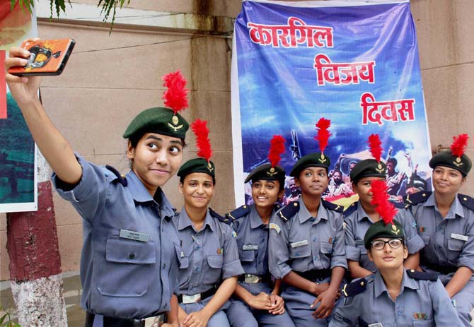 National Cadet Core (NCC) contingents take a selfie during Kargil Vijay Diwas celebrations at Ravindra Bhawan in Bhopal 