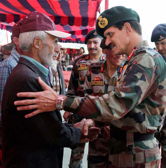 Chief of Army Staff, General Dalbir Singh meets family members of soldiers after paying homage to the martyrs of OP VIJAY at the historic Kargil War Memorial, at Drass, Jammu and Kashmir
