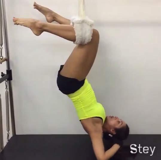 Dressed in a sexy neon top and black shorts, Malaika Arora is in a total workout mode as she does upside down crunches