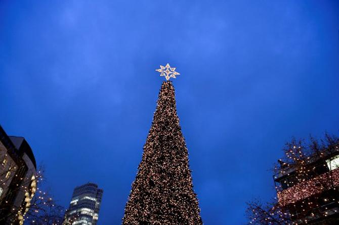 People visit the Christmas market at Breitscheidplatz in western Berlin's main shopping district during the Christmas holidays