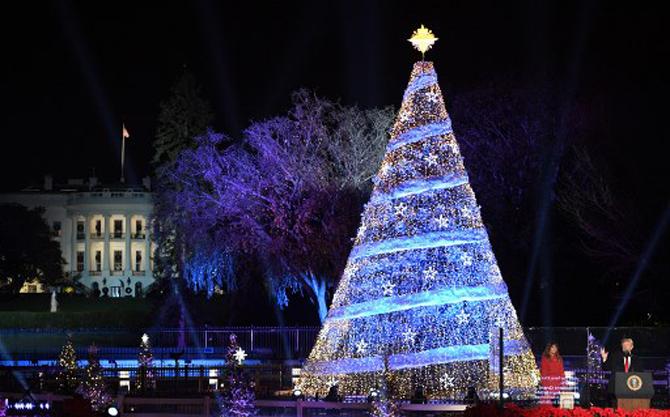 The US First Lady, Melania Trump looks on during the 95th annual National Christmas Tree Lighting ceremony at the Ellipse in President's Park near the White House in Washington, DC