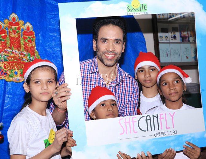 Tusshar Kapoor's photo-op moment with kids of the NGO in Mumbai