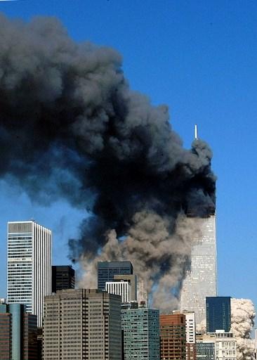 The twin towers of the World Trade Center billow smoke after hijacked airliners crashed into them early on September 11, 2001. The suspected terrorist attack caused the collapse of both towers.