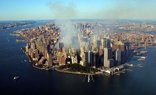 Smoke continues to rise from the destroyed World Trade Center on September 15, 2001, in New York. US President George W. Bush declared the United States 'at war' against the 'barbarians' who led terror strikes on New York and Washington, including the man he called the 'prime suspect': Osama bin Laden.