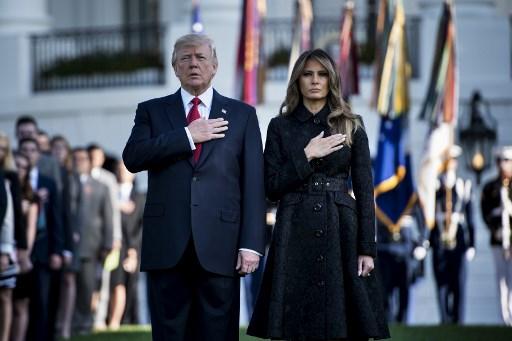 US President Donald Trump and First Lady Melania Trump observe a moment of silence on September 11, 2017, at the White House in Washington, DC, during the 16th anniversary of the 9/11 attacks.