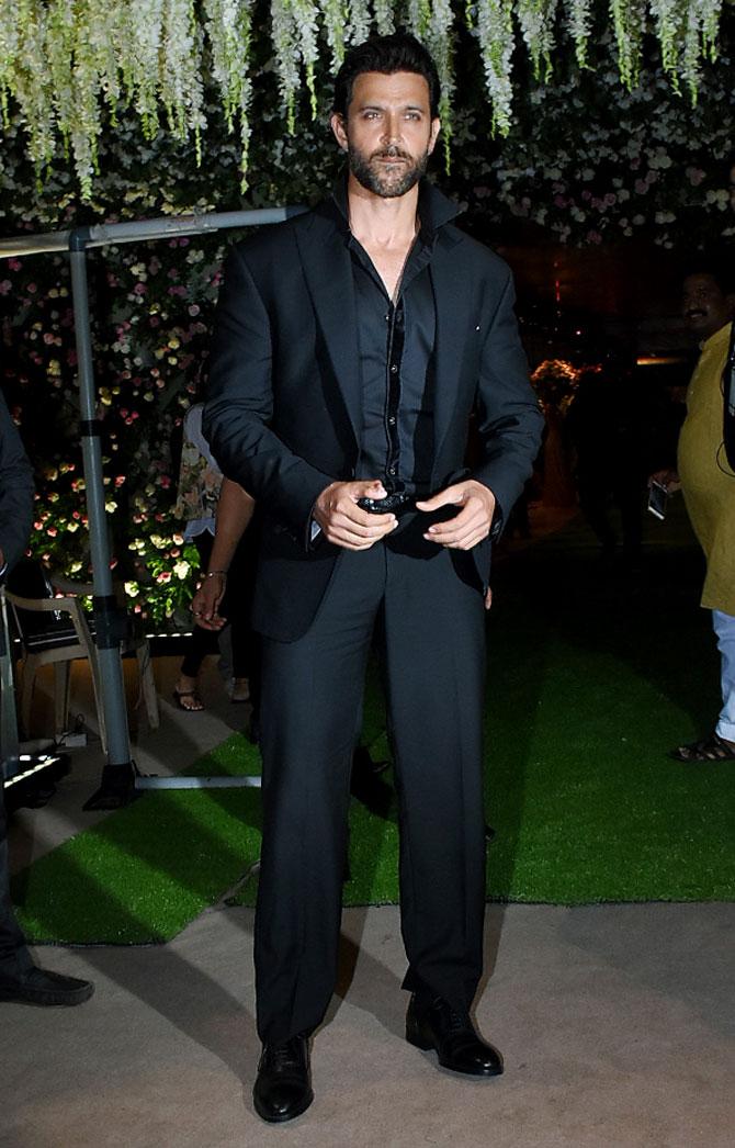Hrithik Roshan looked dapper in a black blazer suit at Poorna Patel's wedding reception with Namit Soni in Mumbai