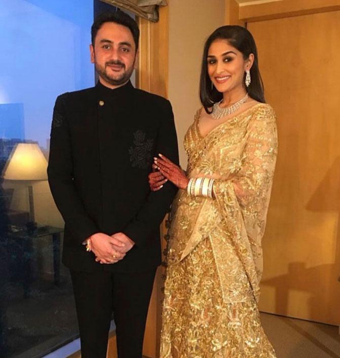 National Congress Party leader Praful Patel's daughter Poorna Patel tied the knot with her longtime beau and businessman Namit Soni over the weekend. For her reception, Poorna looked stunning in a custom-made Manish Malhotra golden lehenga while her husband wore a black suit. All pictures/Yogen Shah