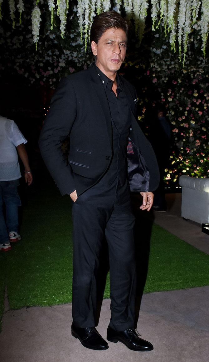 Shah Rukh Khan, who is all geared up for his upcoming film, 'Zero', donned a three-piece black suit at ,Poorna Patel's wedding reception with Namit Soni in Mumbai