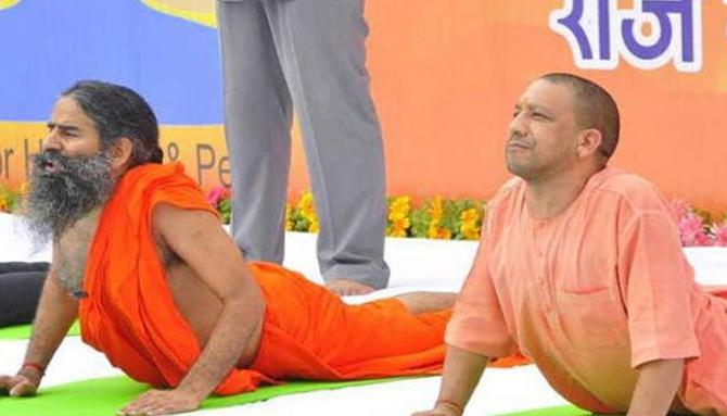 Uttar Pradesh Chief Minister Yogi Adityanath can truly bend his body. He is seen here with Yoga guru Baba Ramdev at a public event