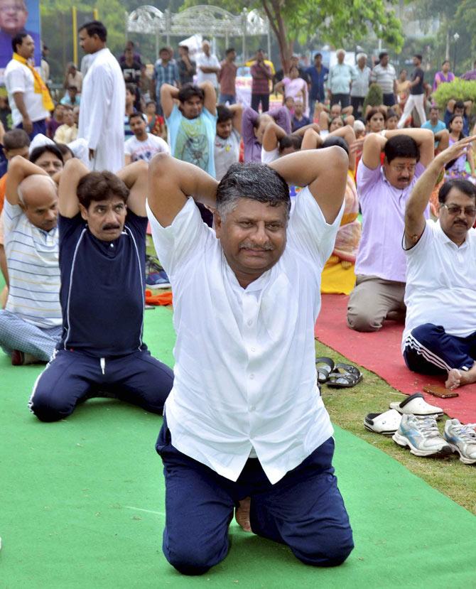 Union Minister for Electronics & Information Technology, Law & Justice, Ravi Shankar Prasad performs Yoga on International Yoga Day at Shivaji Park in Patna