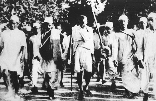 In 1930, Mahatma Gandhi protested against Britain's Salt Acts, which not only prohibited Indians from collecting or selling salt - a dietary staple - but imposed a heavy tax that hit the country's poor. Gandhi planned a new Satyagraha campaign that entailed a 390-kilometer/240-mile march to the Arabian Sea, where he would collect salt in symbolic defiance of the government monopoly. Mahatma Gandhi (C) is pictured with his followers in this March 1930 photo during the famous salt march to Dandi, Gujarat.