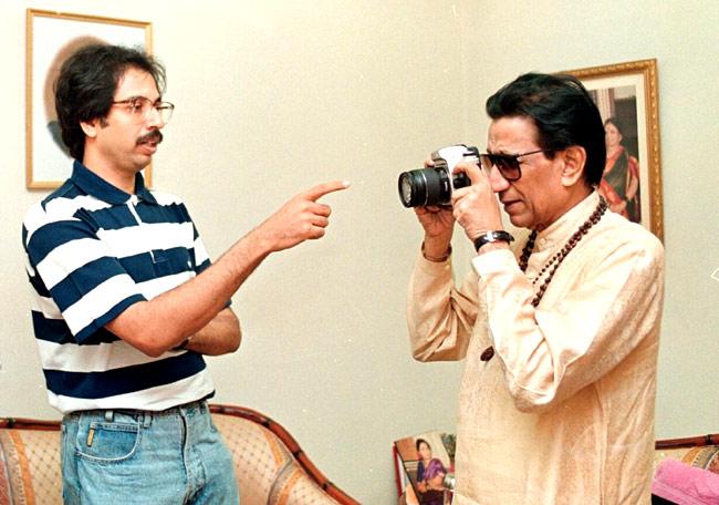 In picture: Bal Thackeray tries his hand at photography while his son Uddhav looks on