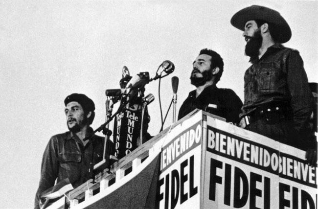 Picture of Cuban leader Fidel Castro (C) delivering a speech next to Camilo Cienfuegos (R) and Ernesto Che Guevara (L) in 1959 in Havana.