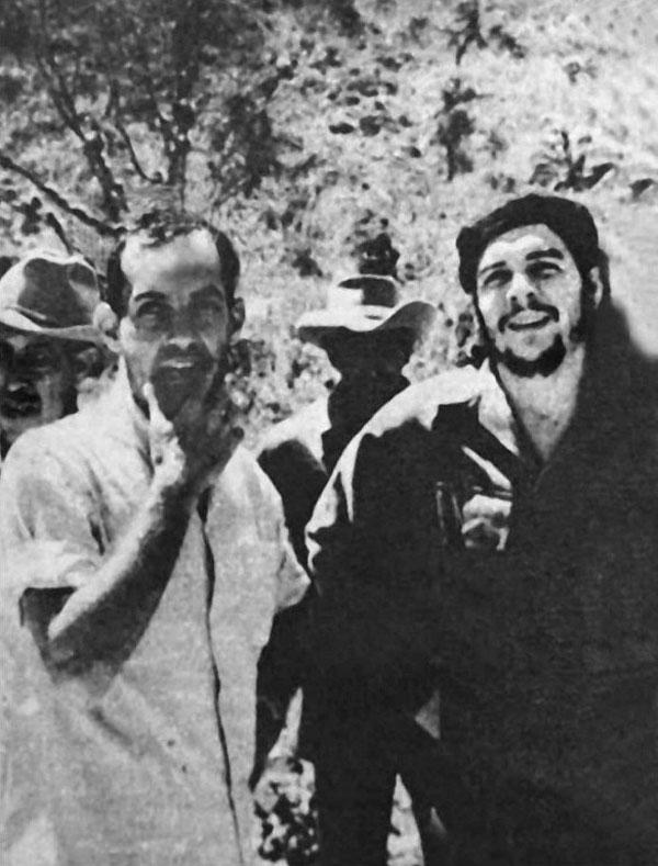 The 1960 file photo shows Cuban film director Tomas Gutierrez Alea (Titon) (L), discussing his film 'History of the Revolution' with Che Guevara (R) when Guevera visited the director on location. 