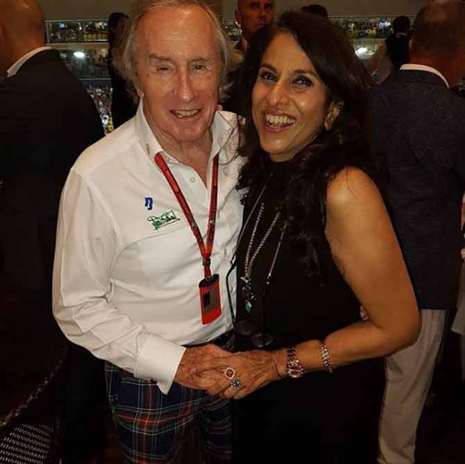 The stylish socialite was seen warmly welcoming, former British Formula One racing driver, Sir Jackie Stewart, at the Singapore Grand Prix