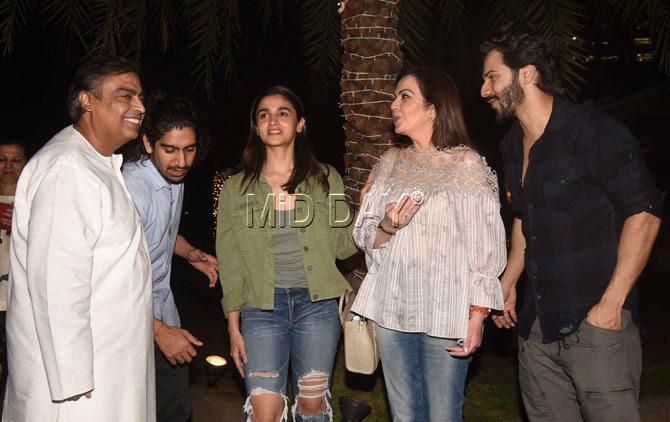 Mukesh Ambani was spotted wearing a white kurta while Nita Ambani went for a peach frill top with jeans