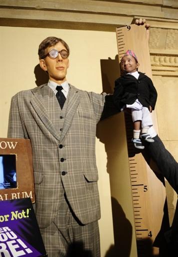 Khagendra Thapa Magar, the world`s smallest teen, is held next to a life-sized figure of Robert Wadlow, the world`s tallest man ever, to mark his introduction into Ripley`s Believe It or Not latest book during a photo shoot on Times Square in New York on Tuesday. The Nepalese 17-year old made his entry into the record book as the world`s smallest male teen standing just 55.9 centimetres (22 inches) tall. AFP