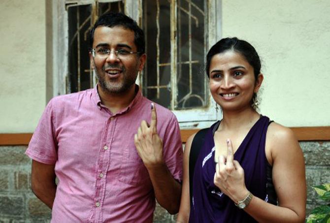 Anusha Bhagat: Anusha Bhagat's love story became a bestselling novel after her author-husband Chetan Bhagat penned it down. She is photographed here after casting her vote along with her husband. Pic/AFP
