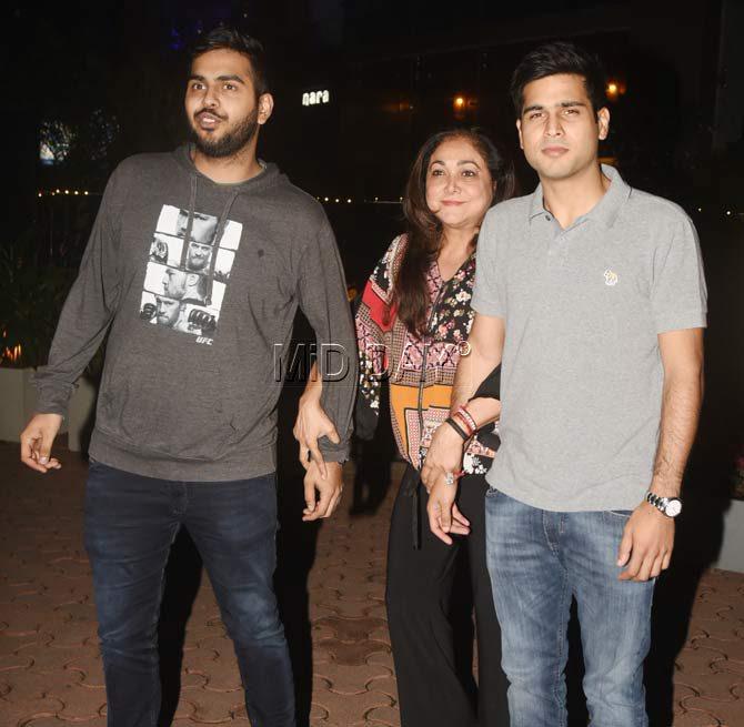 Tina Amnai proudly stood along-side her two sons as they entered a restaurant in BKC