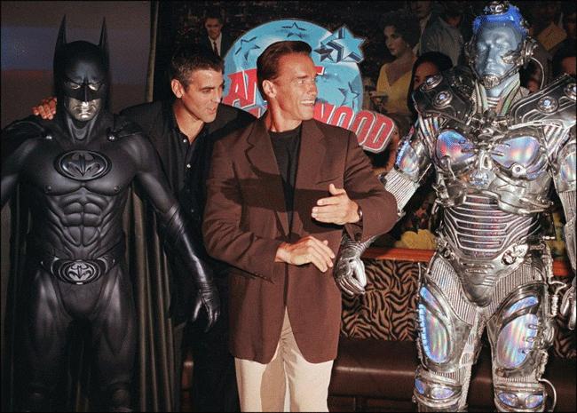 Arnold Schwarzenegger and George Clooney standing along with 'Mr Freeze' and 'Batman' character suits from their movie Batman and Robin. (Pic-AFP)