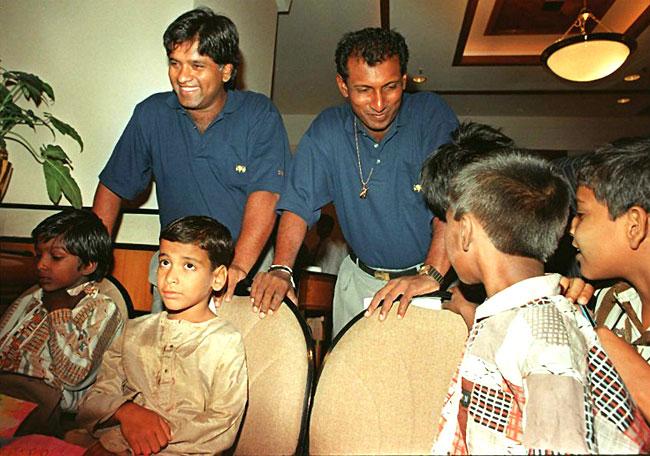 No kidding! Former Sri Lankan skipper Arjuna Ranatunga (L) and Aravinda De Silva spend some time with orphan children in a south Mumbai hotel during the Lanka's visit to India in the 90s
