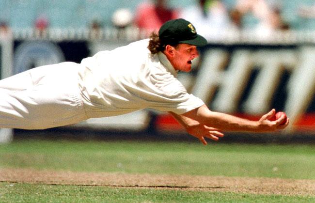 Just like Jonty! South African fielder Brian McMillan dives full length for a catch, which unfortunately for him only came off the pads of an Australian batsman during a Test match in Australia in 1997