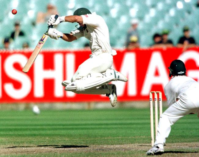 No leap of joy this: Jacques Kallis is airborne as he fends off a ball from Michael Kasprowicz on the fourth day of the first Test Match between Australia and South Africa in Melbourne on December 27, 1997
