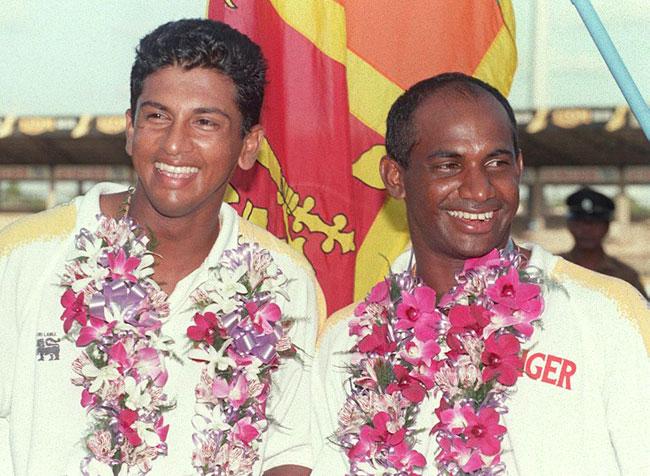The world at their 'feat': Sri Lanka's Roshan Mahanama (L) and Sanath Jayasuriya being felicitated after setting a new world record in test cricket with a 576-run partnership during the Colombo Test against India in August 1997