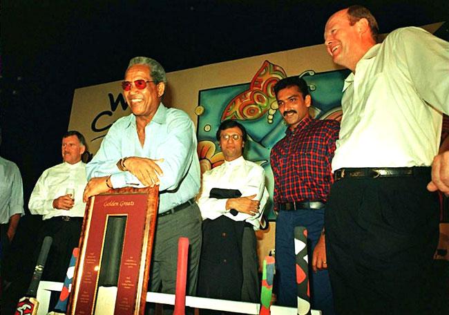 All the great men: Cricketing legends Ian Chappell (far left), Sir Gary Sobers (leaning on plaque), Asif Iqbal (centre back), Ravi Shastri (2nd right) and Tony Greig at a cricket memorabilia auction in a hotel in south Mumbai in 1997