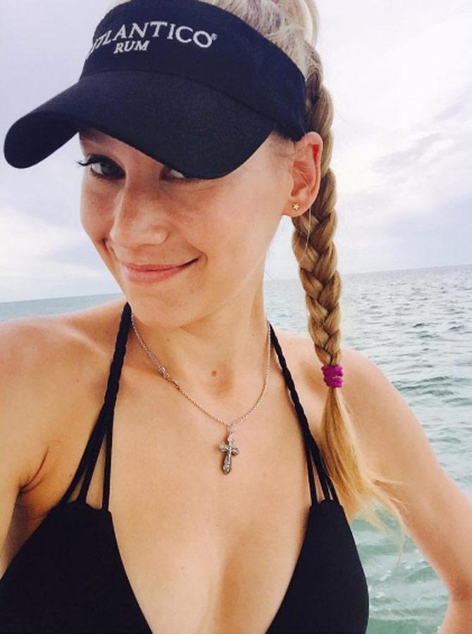 Kournikova's singles tennis record is 209-129