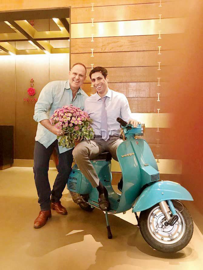 Former Australia opener Matthew Hayden tweeted this picture of himself gifting a bouquet to Ashish Nehra, happily smiling for the camera, on a scooter