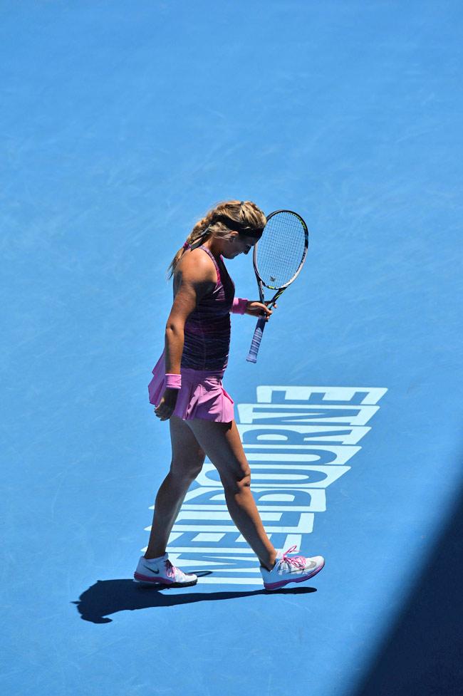 Belarus's Victoria Azarenka reacts after losing her women's singles match against Poland's Agnieszka Radwanska