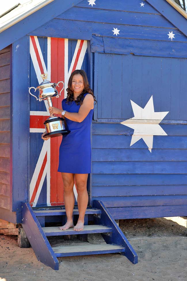 Li Na of China poses with the trophy following her victory over Dominika Cibulkova of Slovakia in the women's singles final
