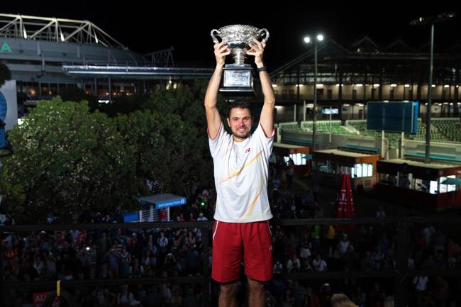 Switzerland's Stanislas Wawrinka holds the trophy after his victory against Spain's Rafael Nadal during the men's singles final