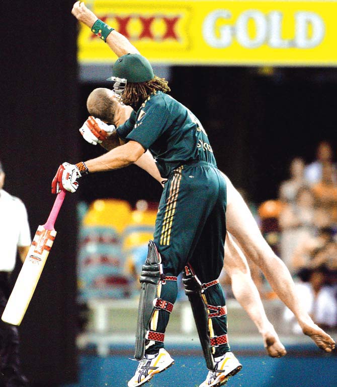 Symonds tackle! Australian cricketer Andrew Symonds clashes with streaker Robert Ogilvie during the second tri-series final against India in Brisbane on March 4, 2008. Ogilvie, who appeared at the Brisbane Magistrates Court on March 5, insisted he had no regrets about his on-field romp, saying it was 'great' when the burly all-rounder smashed him to the Gabba ground turf with a shoulder charge. Pic/ Getty Images