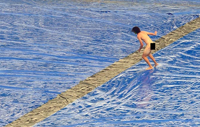 Buddhists offended!: This photo, taken on July 26, 2016, shows an Australian man running naked at a Test cricket match between his country and hosts Sri Lanka at the Pallekele stadium in the central hill district of Kandy. A Sri Lankan court on July 27 jailed and fined an Australian streaker for indecent exposure during a cricket Test between the nations, an act which local Buddhist priests found offensive. A police official said they pressed charges in part because his actions had hurt the sensibilities of Buddhist priests in Kandy, home to one of Sri Lanka's holiest shrines, the Temple of the Tooth. Pic/ AFP