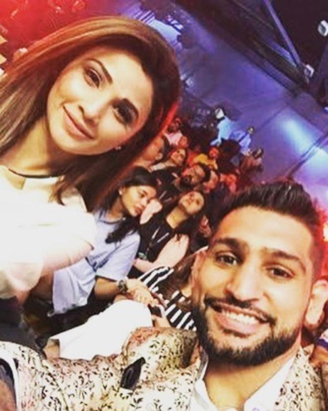 In picture: Amir Khan chilling out with Bollywood actress Daisy Shah.