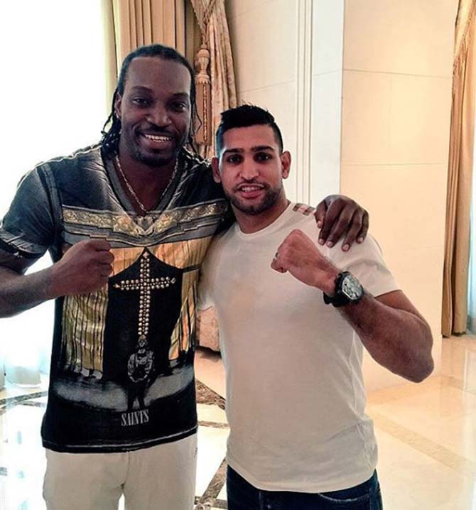In picture: Amir Khan with West Indies stylish player Chris Gayle.