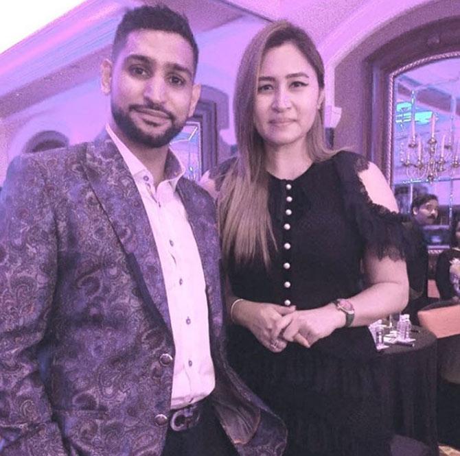 In picture: Amir Khan with Indian shuttler Jwala Gutta during a party.