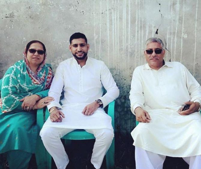 In picture: Amir Khan with his parents during Eid.