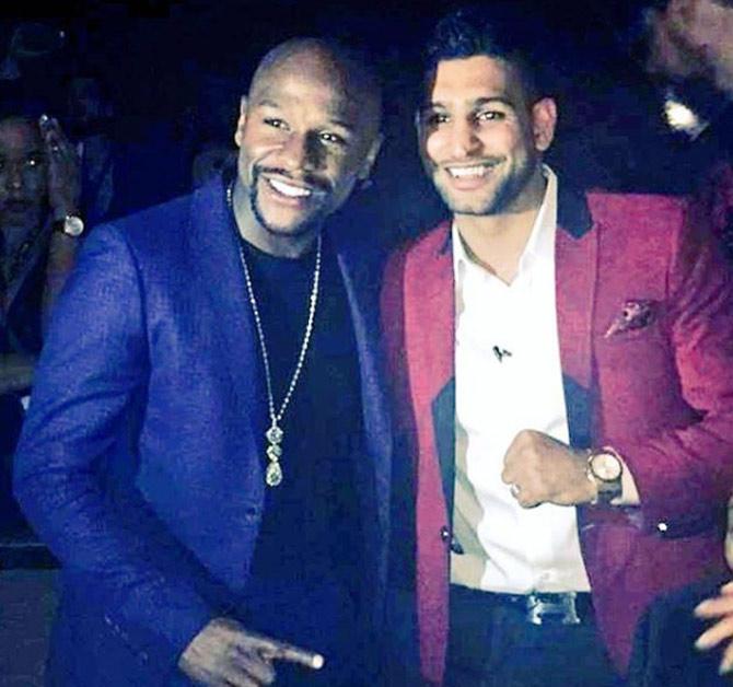 In picture: Amir Khan with boxing great Floyd Mayweather Jr.