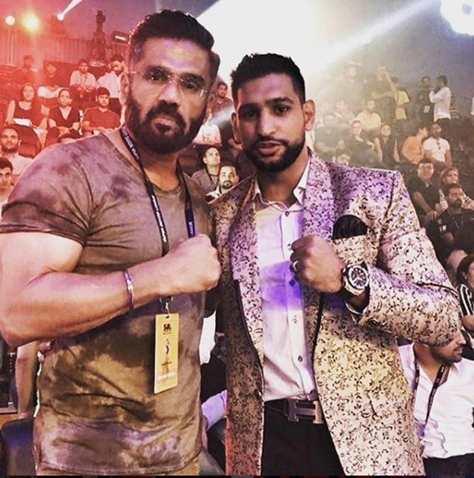 In picture: Amir Khan with Suniel Shetty at an event.