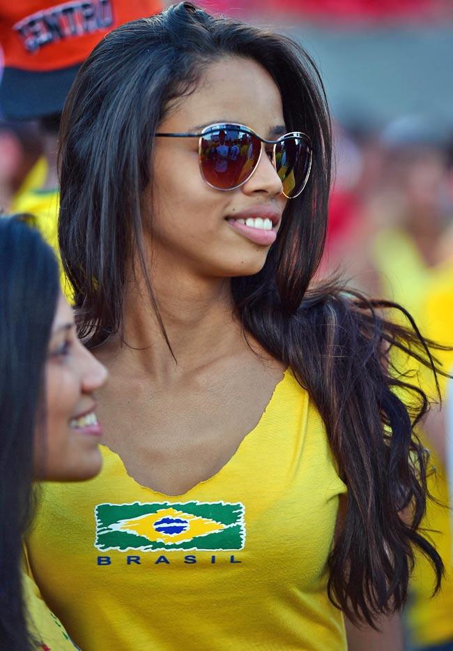 A Brazilian fan watches a live screening of her team's match against Croatia