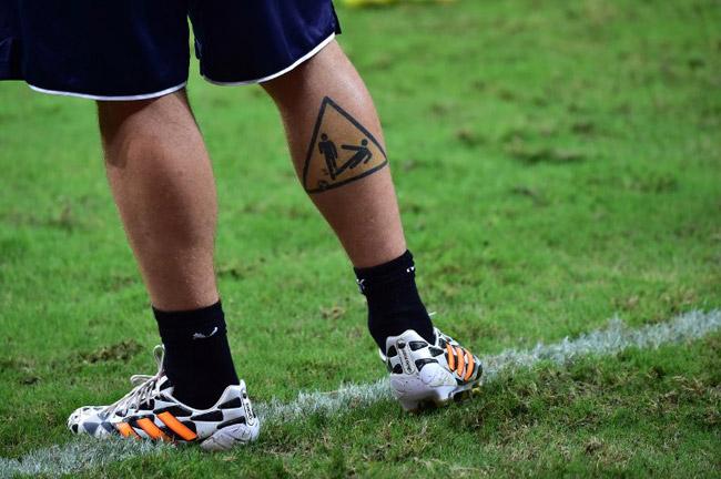 A picture shows the tattoo of Italy's midfielder Daniele De Rossi as he takes part in a training session