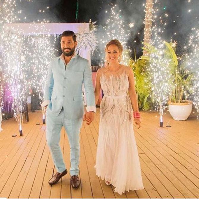 Newly weds Yuvraj Singh and Hazel Keech make a grand entry at the reception. 