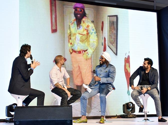 Gaurav Kapoor chats with Shikhar Dhawan, Chris Gayle and Rohit Sharma during the CEAT Awards 2018 event in Mumbai