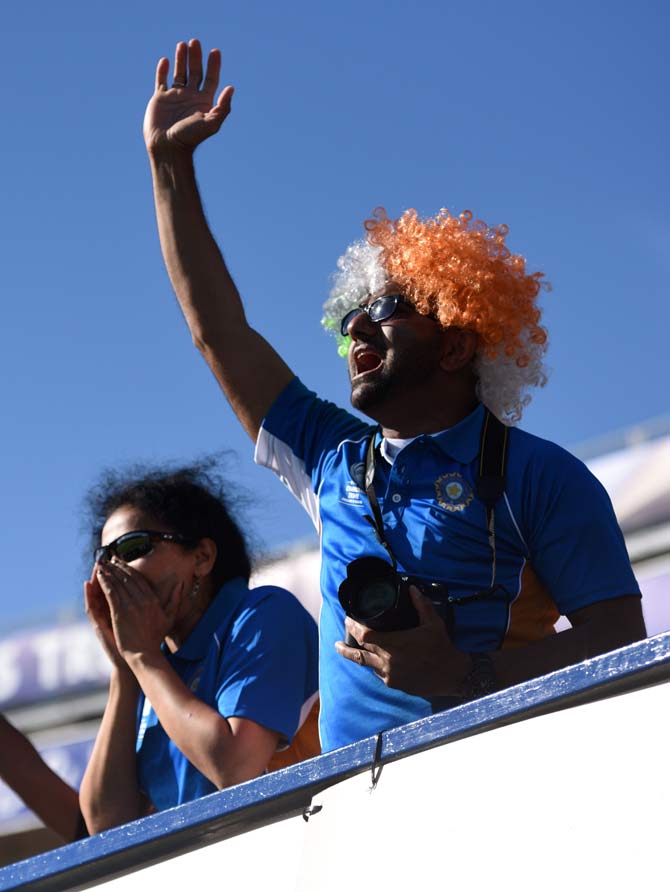 Indian fans celebrate during the ICC Champions trophy match