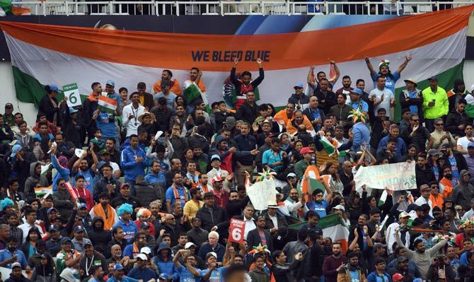 India and Pakistan had a rain-hit match during their Champions Trophy encounter, but the fans had much to be happy about as they cheered their teams on througout the game. (Pics AFP/ PTI)