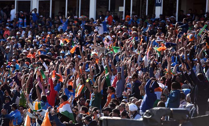 Indian fans perform a 'mexican wave' during the ICC Champions trophy match between India and Pakistan