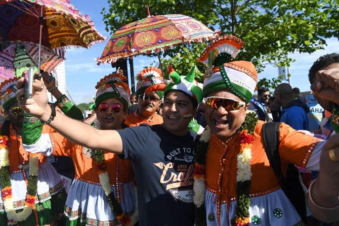 India fans take a selfie ahead of the ICC Champions trophy cricket match between India and Pakistan